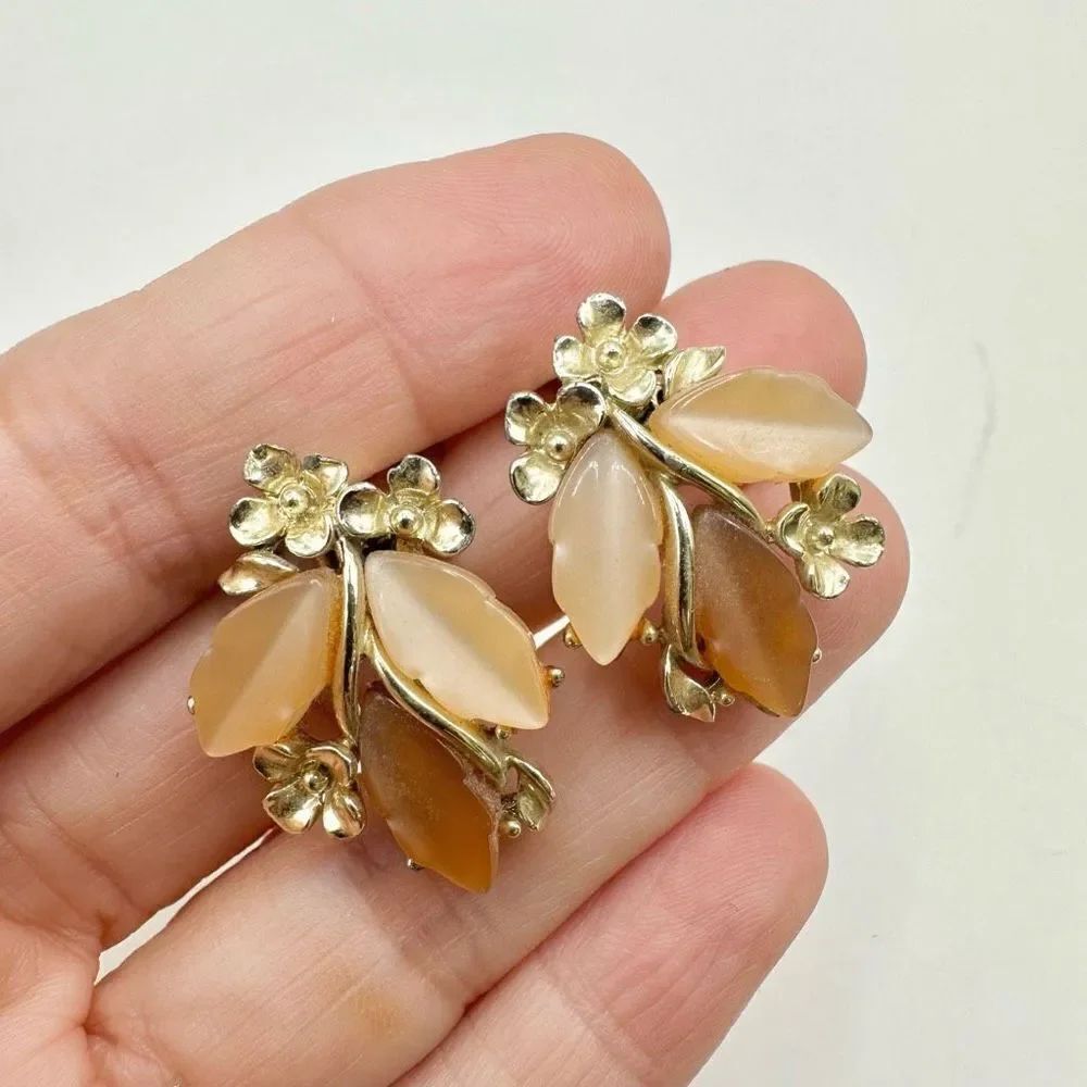 Gold tone orange leaf floral clip on earrings